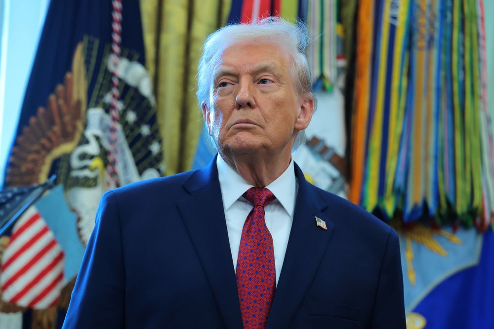 resident Donald Trump listens during a ceremony for the presentation of the Mexican Border Defense Medal in the Oval Office of the White House on December 15, 2025 in Washington, DC. During the ceremony (Getty Images)