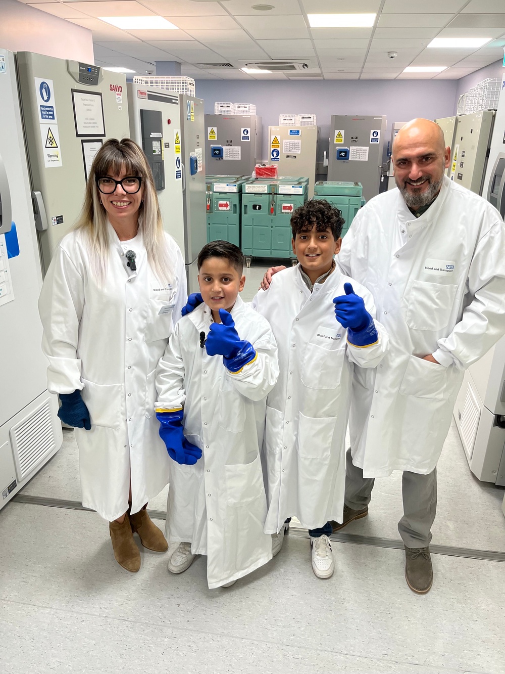 Qasim Rizwan (second left) required every unit of rare blood available to him in the country after being diagnosed with autoimmune haemolytic anaemia (AIHA). Doctors initially struggled to match his blood type but scientists discovered he was a rare mix, including r’r’, a subtype of the Rhesus system that is shared by roughly one in 10,000 people. Only around 50 blood donors are type r’r’. Qasim, now 9, visited NHSBT’s national frozen blood bank in Liverpool in August with his father Rizwan Ahmed, 46, (right) and brother Yusuf (second right) to thank staff for their help. Pictured with frozen blood bank manager Joanne Mattews (NHSBT/PA)