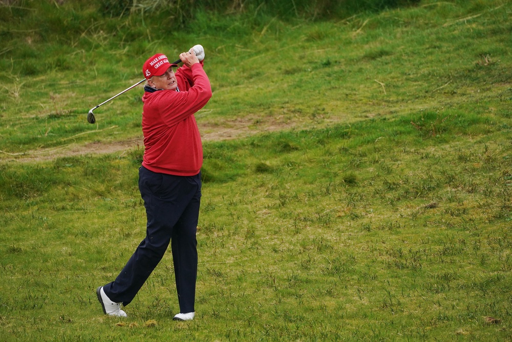 US President Donald Trump on the 15th hole at Trump International Golf Links & Hotel in Doonbeg, Co Clare, during his visit to Ireland in 2023 (Brian Lawless/PA) (PA Archive)