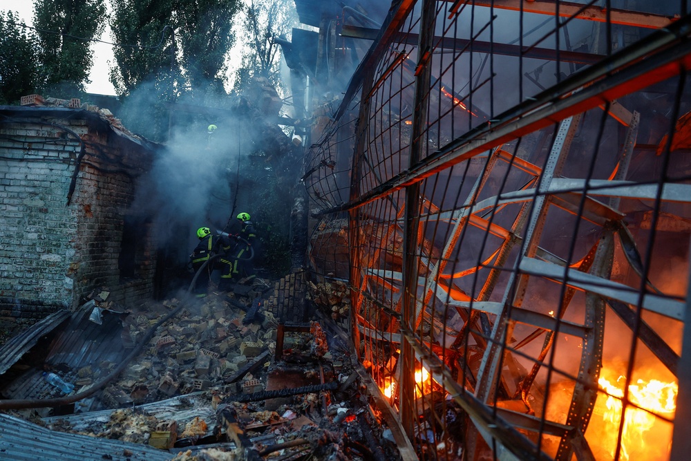 Firefighters work at the site of a non-residential building hit by a Russian drone strike, amid Russia's attack on Ukraine, in Kyiv, Ukraine, 11 September 2026 (Reuters)