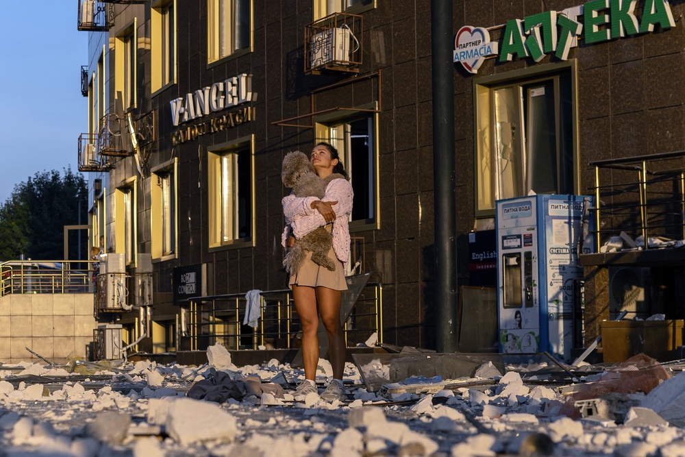 A local resident stands outside a damaged multi-story residential building following attacks in Ukraine’s Odesa (AFP/Getty)