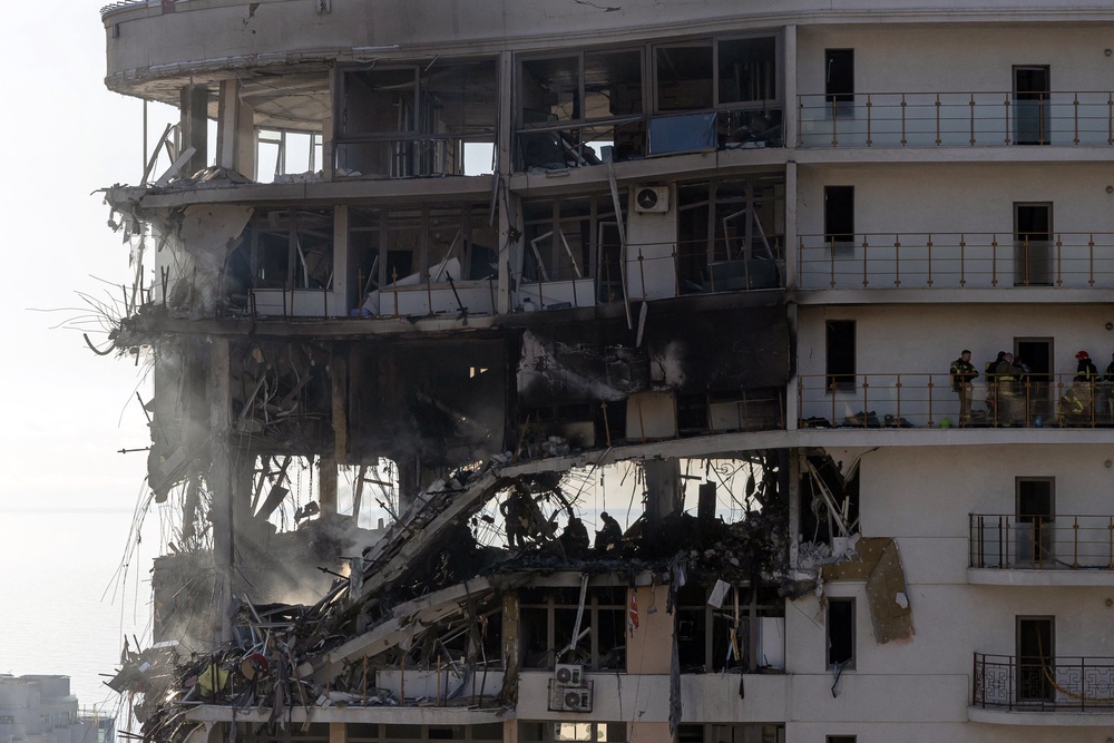 Rescuers work in a multi-story residential building where seventeen people were injured, in Odesa, on Saturday (AFP/Getty)