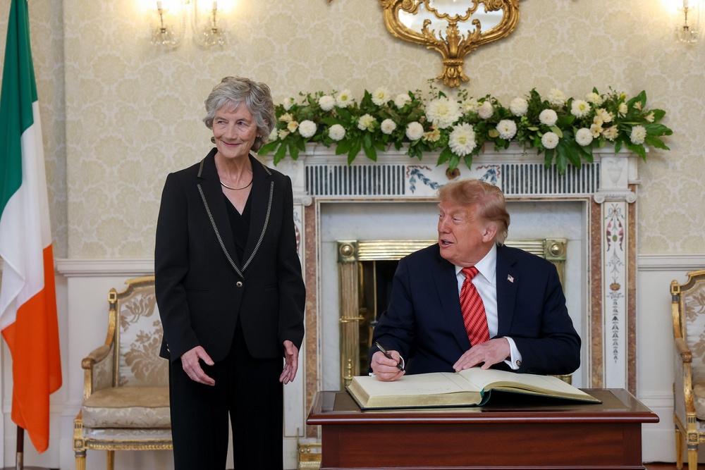 President Catherine Connolly stands by as US President Donald Trump signs the visitors’ book at Áras an Uachtaráin, her official residence in Phoenix Park, Dublin (Tony Maxwell/Maxwells/PA) (PA Media)