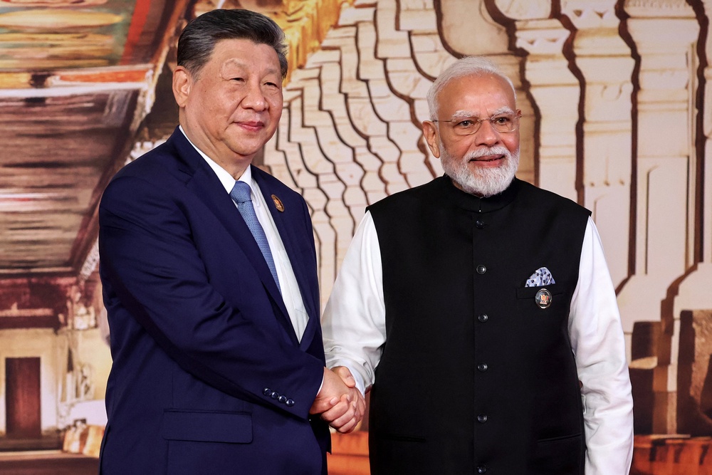 India's Narendra Modi shakes hands with China's Xi Jinping during a welcome ceremony in Delhi (AFP/Getty)