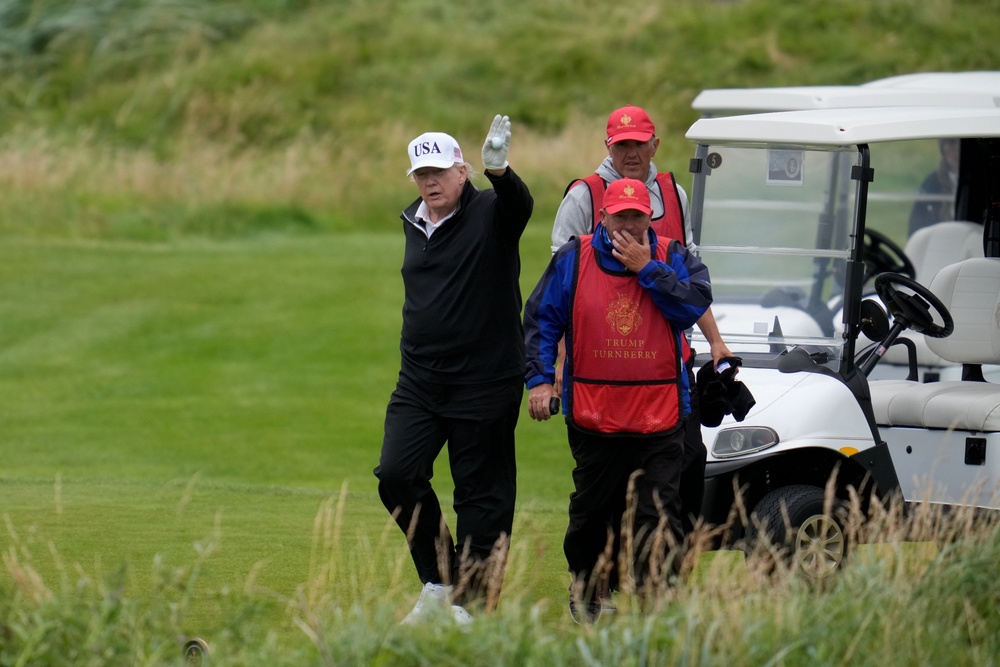 Donald Trump waves as he plays a round of golf at Trump Turnberry golf course during his visit to the UK on July 27, 2025 in Turnberry, Scotland (Getty Images)