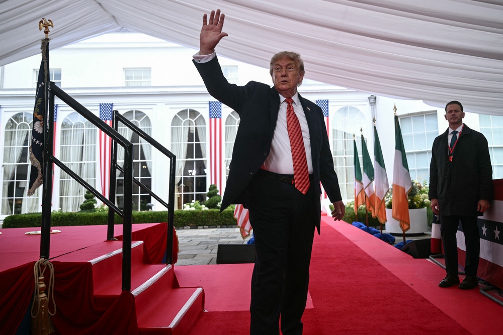 Mr Trump waves after giving a speech at a special function during his visit to the US ambassador's residence in Dublin (AFP/Getty)