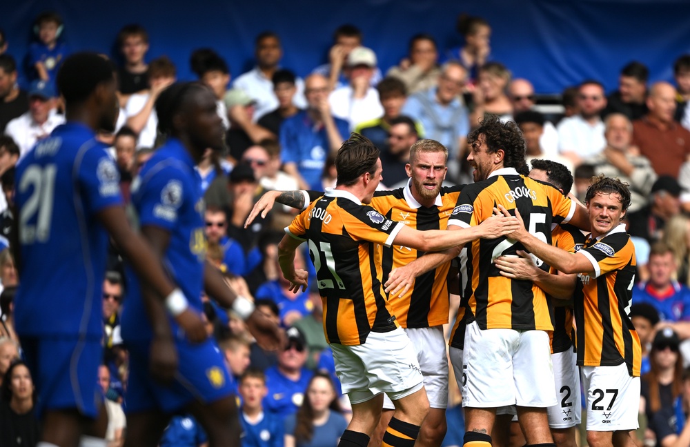 Hull players celebrate after equalising at Stamford Bridge (Getty)