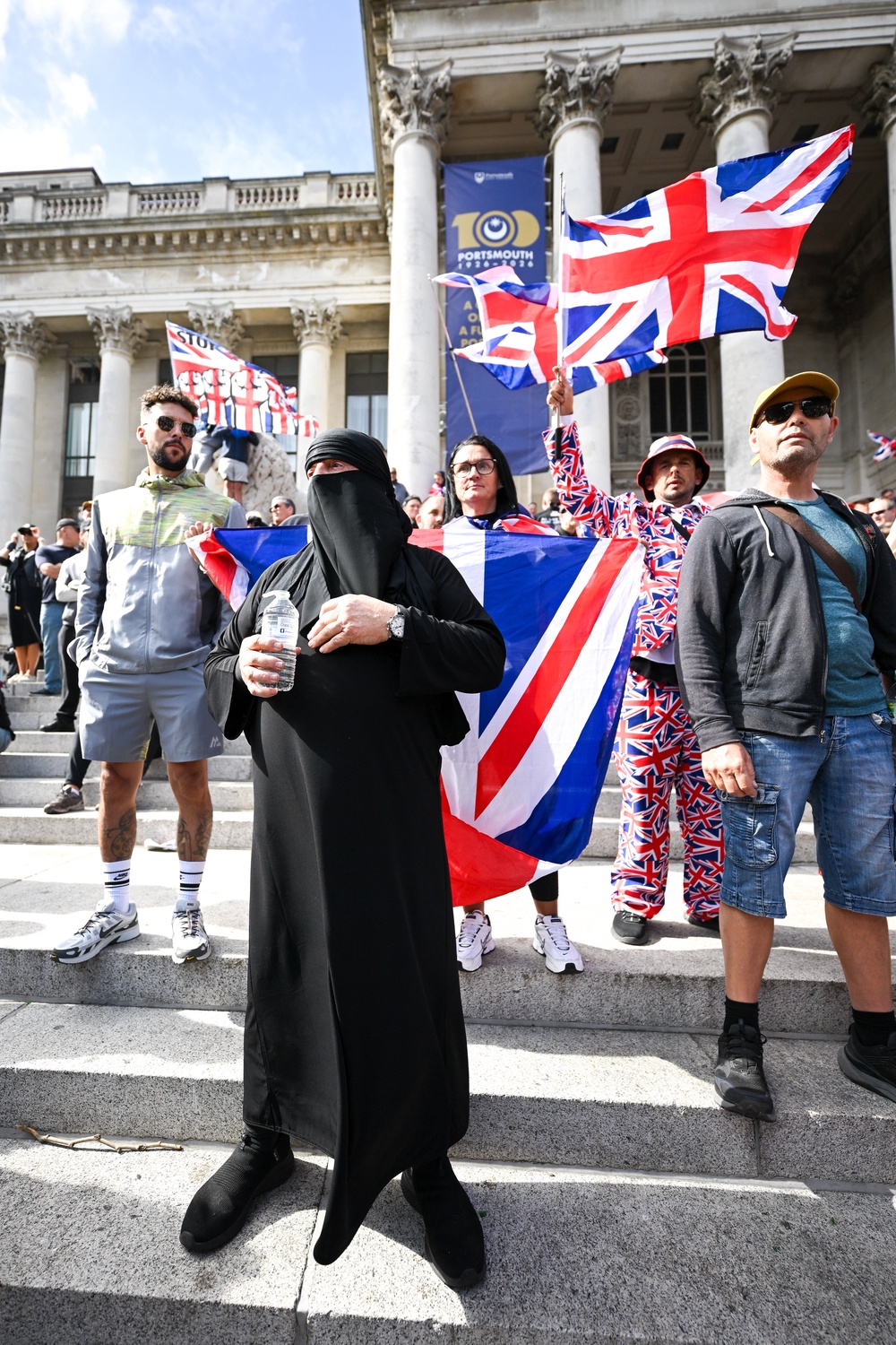 An anti-migrant protester wears a burkha during a march through the city to Guildhall in Portsmouth (Getty)