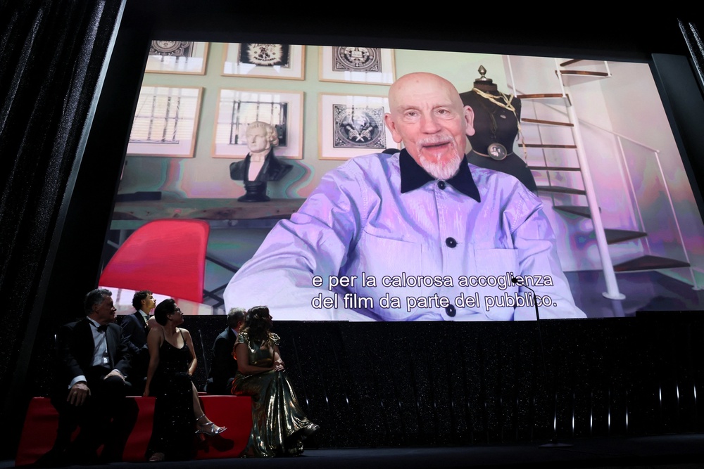 The Jury of the 83rd Venice International Film Festival look at a video message from John Malkovich, winner of the Coppa Volpi Award for Best Actor (Reuters)