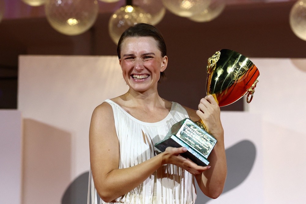 Mathilde Arcel poses with the Coppa Volpi Award for Best Actress (Reuters)