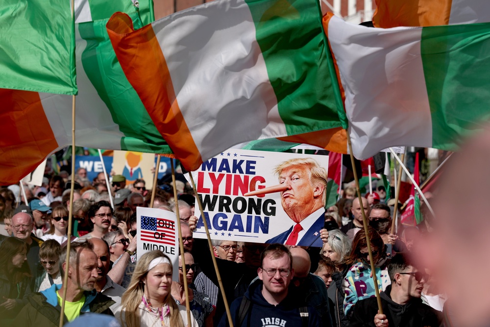 People take part in an anti-Trump protest march through Dublin city (Clodagh Kilcoyne/PA) (PA Wire)