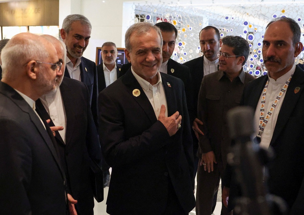 Iranian president Masoud Pezeshkian reacts as he is greeted inside a hotel, during his visit to India to attend the 18th Brics Summit, in New Delhi, India, 12 September 2026 (Reuters)