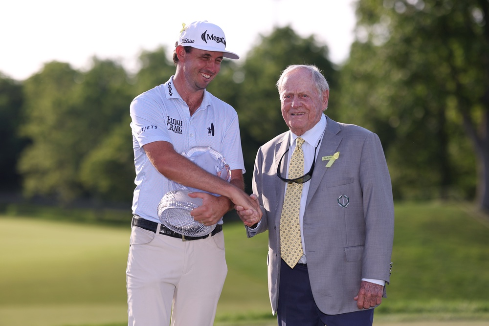 J.T. Poston of the United States shakes hands with Jack Nicklaus as he presents him the trophy during the final round of the the Memorial Tournament presented by Workday 2026 at Muirfield Village Golf Club on June 07, 2026 (Getty)