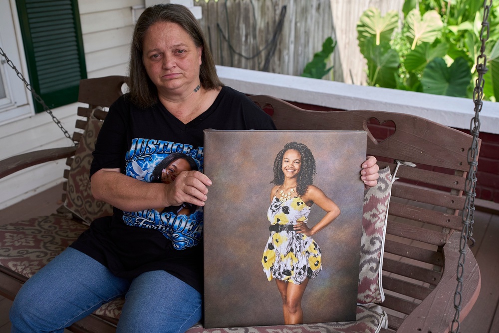 Christy Spivey poses with a portrait of her late daughter Tasia Fortune, Tuesday, Sept. 8, 2026, in Marion, Kentucky (AP)