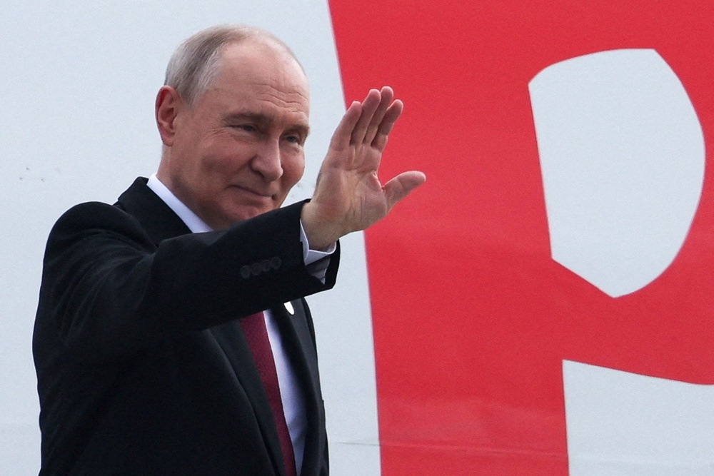 Russian president Vladimir Putin boards a plane as he leaves India after the Brics summit on 13 September 2026 (Reuters)