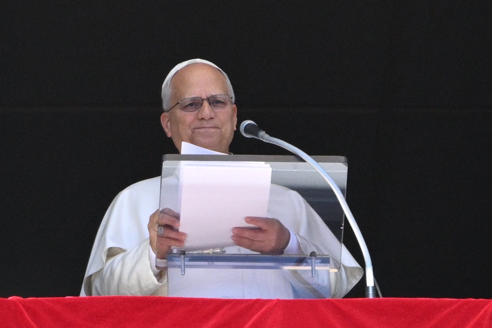 Pope Leo XIV addresses the crowd from the window of the apostolic palace overlooking St Peter's Square during his Sunday Angelus prayer at the Vatican on September 13 (AFP/Getty)
