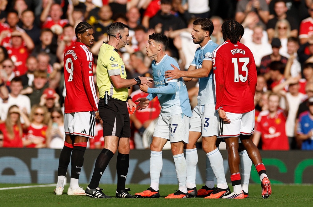 Foden remonstrates with referee Michael Oliver (Reuters)