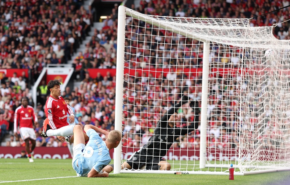 Erling Haaland bundled in in the second half to give 10-man City a memorable away win (Getty)