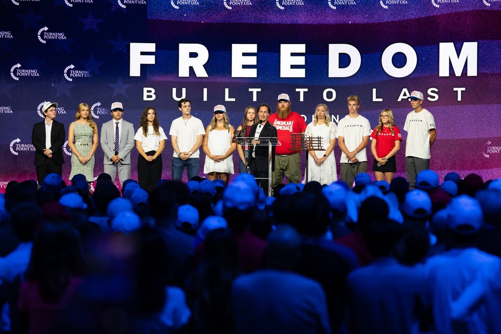 Individuals who were present at the scene of Turning Point USA founder Charlie Kirk's fatal shooting stand together on stage during a Charlie Kirk memorial service at the UCCU Center on September 10, 2026 in Orem, Utah. (Getty)