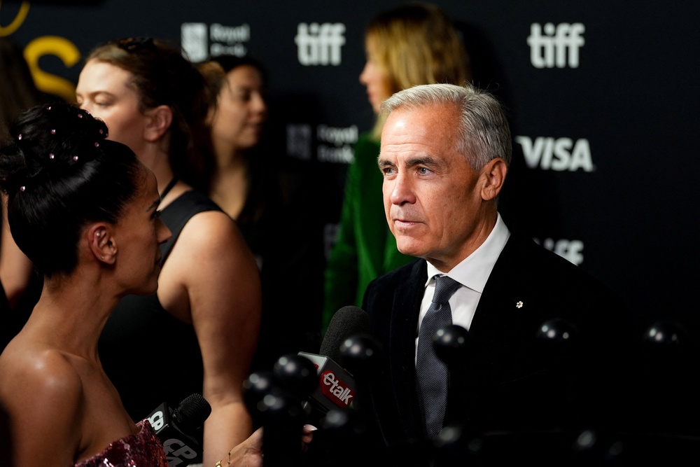 Carney speaks to the media as he attends the Toronto International Film Festival (TIFF) Tribute Awards gala fundraiser (Reuters)