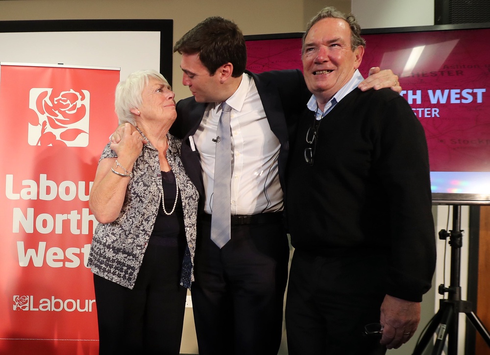 Andy Burnham with his late father Roy (right) and his mother Eileen (PA)