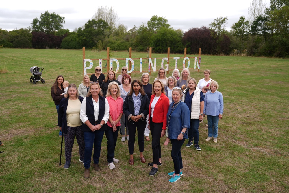 Reform UK MP Sarah Pochin and Reform UK education spokeswoman Suella Braverman with female residents of Piddington village (Joe Giddens/PA) (PA Wire)