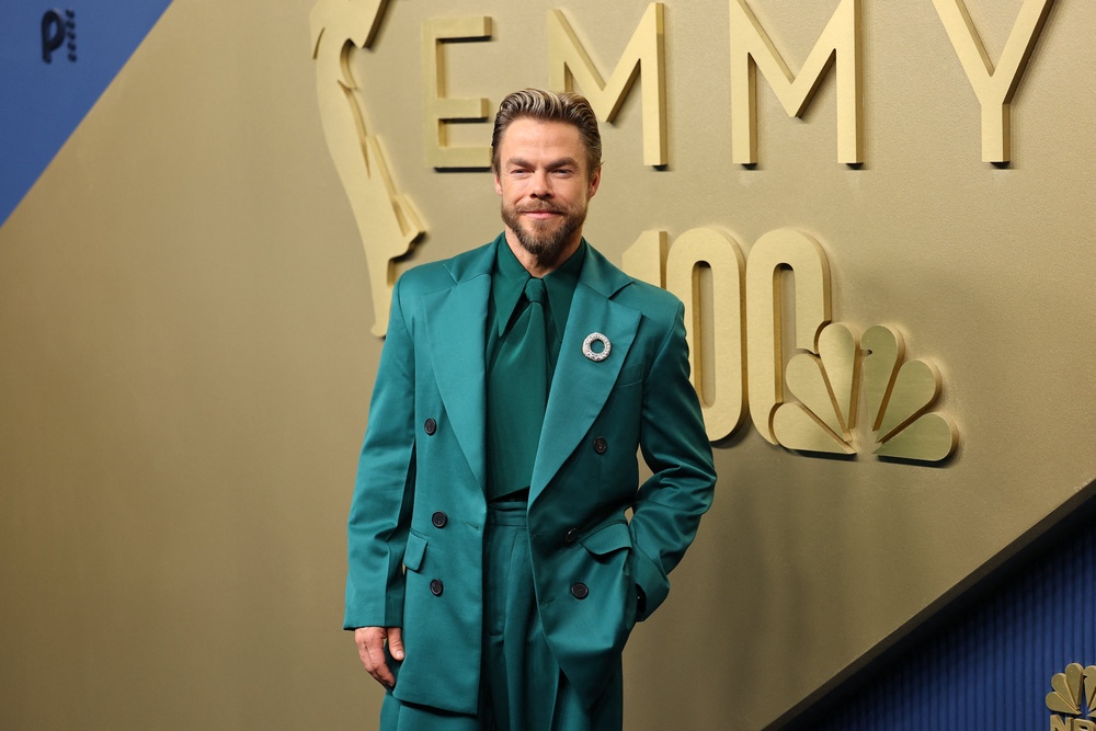 The brooch added a touch of sparkle to make Hough's fit pop even more than it already did thanks to the vibrant hue (Reuters)