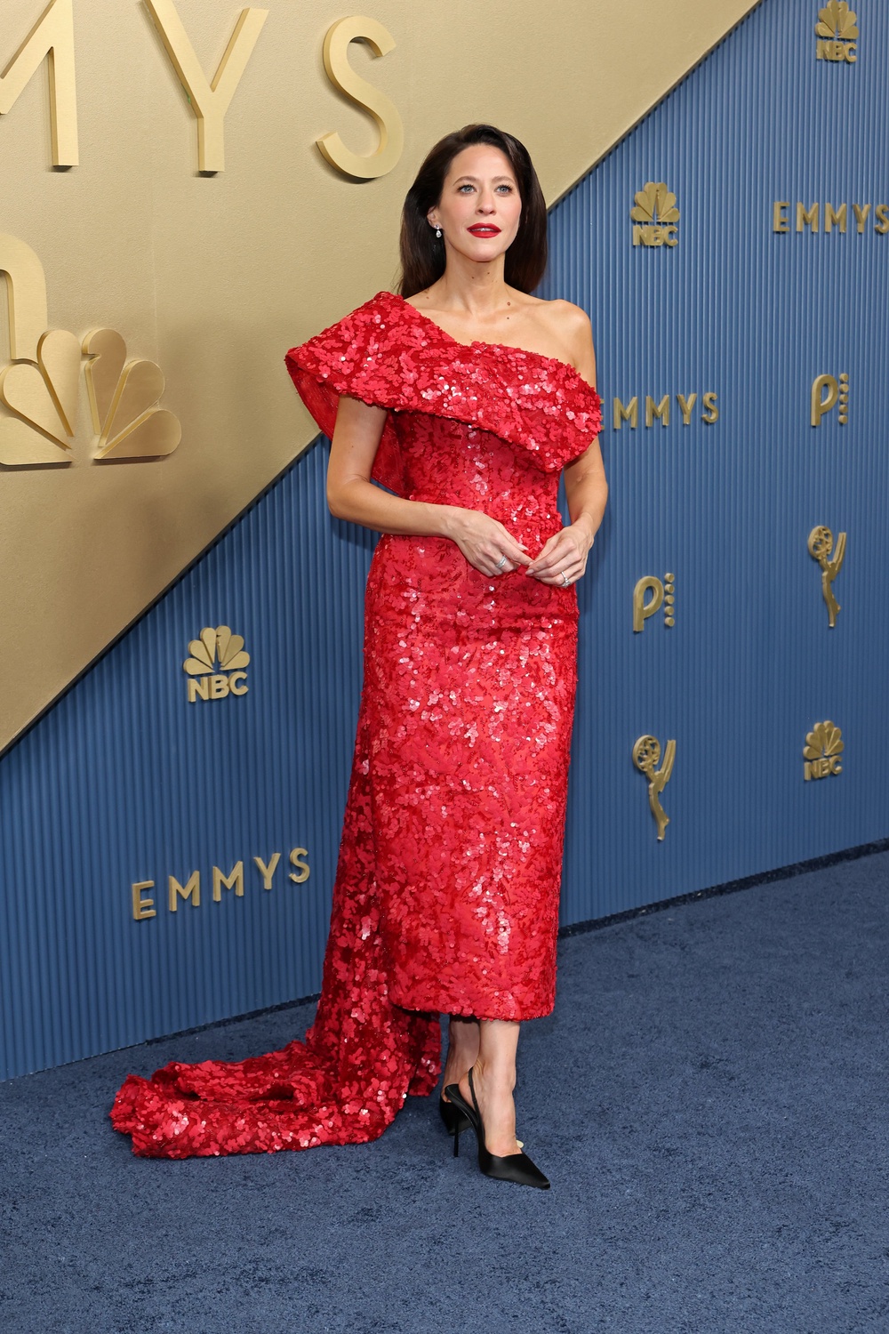 'Nobody Wants This' star Jackie Tohn looked beautiful in a bold red, sequined dress. But the look would've been better served by a plain nude heel; the black draws attention away from the dress (Getty)
