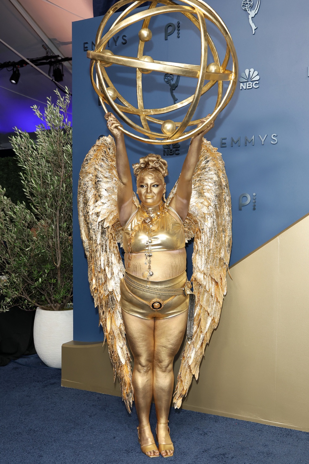 'Hacks' star Meg Stalter dressed for the Emmys as ... an Emmy. Complete with gold face paint. Wow (Getty)