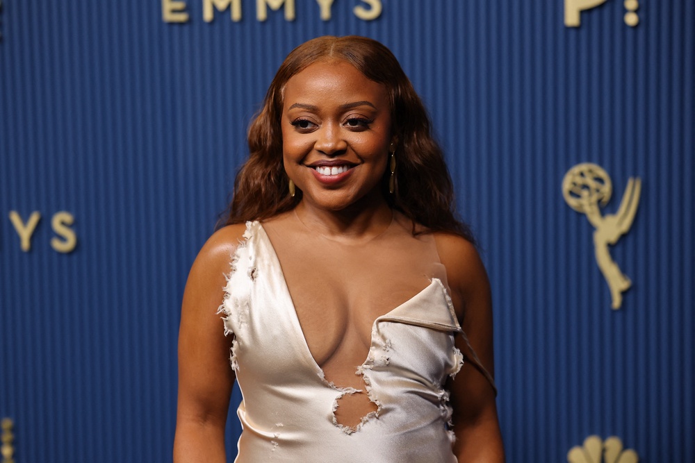 'Abbott Elementary' star Quinta Brunson's gown was ... intentionally messy? It looked like it had fallen victim to a dog at playtime with its ripped seams and stitches (Reuters)