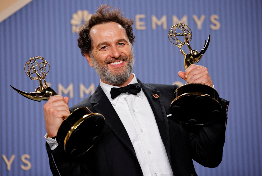 Matthew Rhys poses with the two actor awards that he won at the Emmys (Reuters)