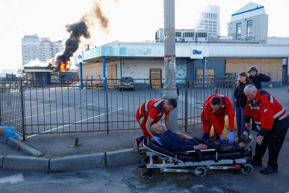 Paramedics prepare to transport a resident injured during a Russian drone strike on a gas station, amid Russia's attack on Ukraine, in Kyiv, Ukraine September 15, 2026. (Reuters)