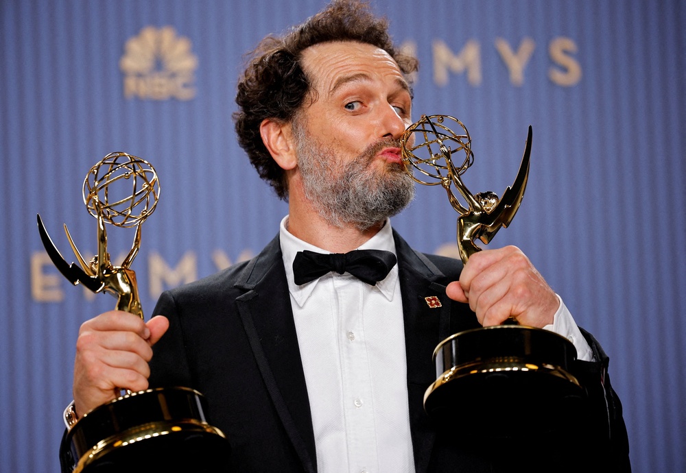 Matthew Rhys poses with his two, history-making Emmys (Reuters)