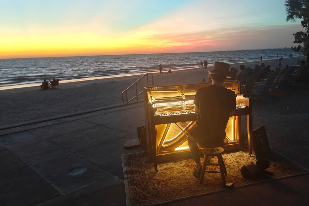 A pianist plays amid a fiery sunset at Passe-a-Grille in St Pete (Marc Shoffman)