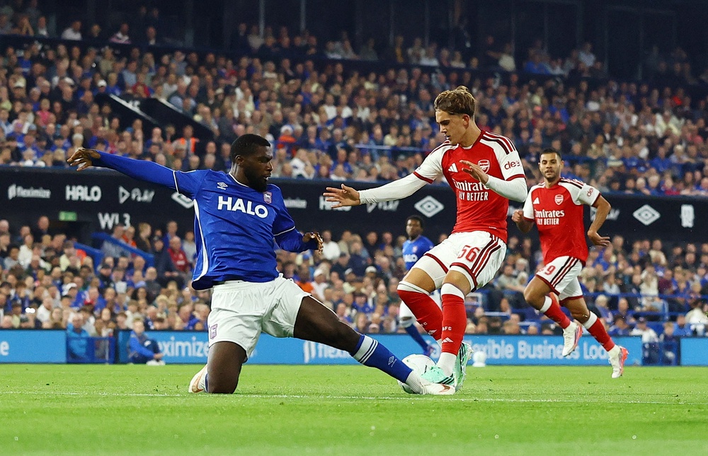 Dowman skips past Ipswich Town's Cedric Kipre (Reuters)