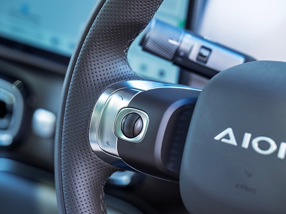 The steering wheel-mounted buttons could do with a bit of explanation – a graphic showing what they do would be useful (Aion)