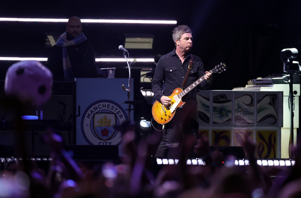 Noel Gallagher onstage at Pasadena's Rose Bowl, one of a string of shows that confirmed Oasis had 'cracked' America (Getty)