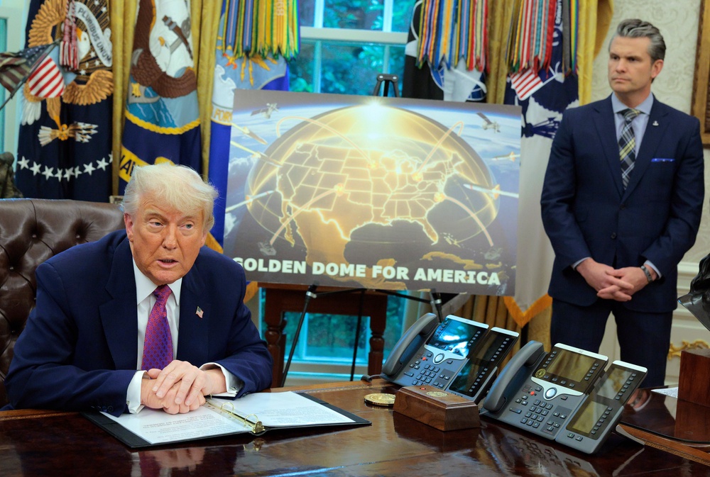 Donald Trump speaks alongside secretary of defence Pete Hegseth at the White House on 20 May 2025 (Getty)