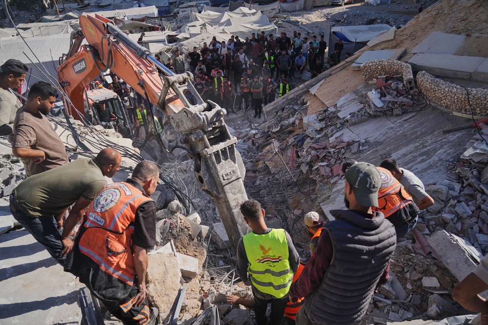 Palestinian civil defense crews search for bodies and survivors in the rubble of a collapsed building that housed displaced Palestinians and was heavily damaged during the Israel-Hamas war, in Gaza City, Wednesday, Sept. 16, 2026. (AP)