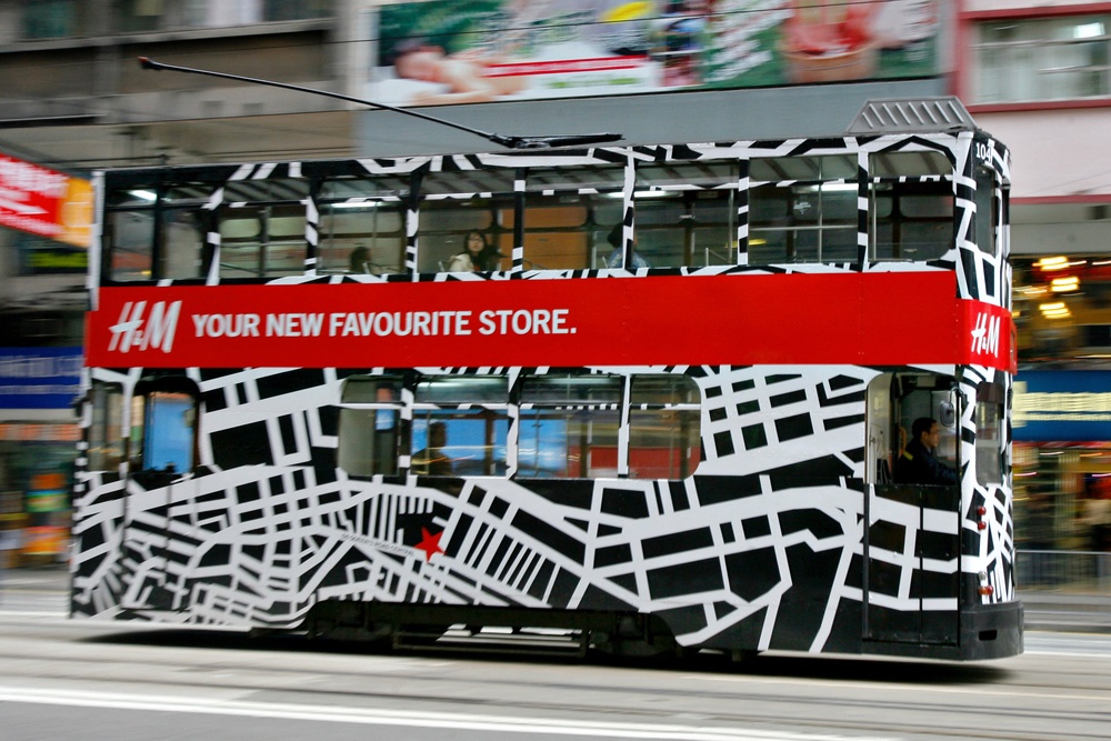 A bus wrapped in an ad for H&M, a fast fashion giant (AFP/Getty)