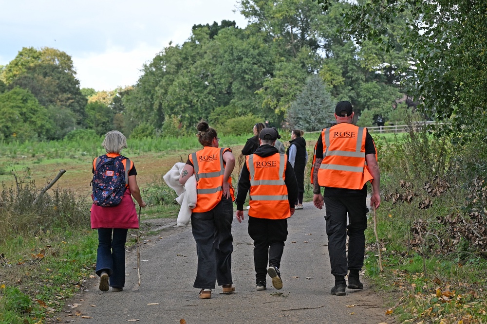 Local residents join police officers as they continue their search near Merriam Close, Brantham (PA)