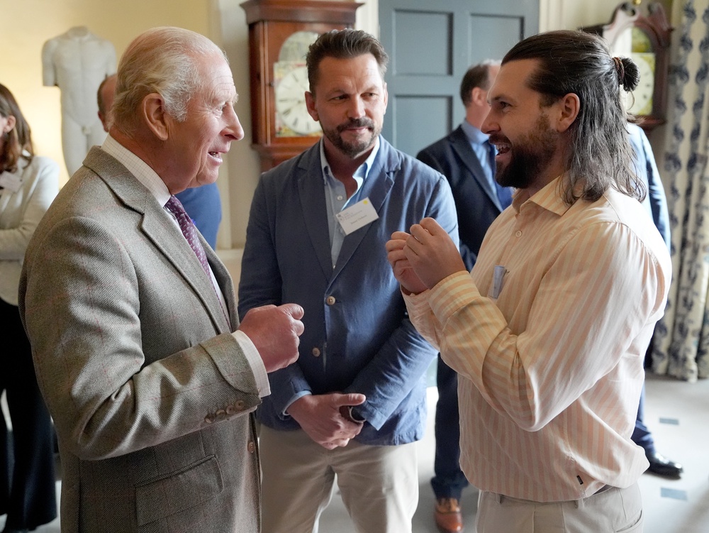 TV farmer Jimmy Doherty, centre, and content creator Sam Bentley, right, chatted with Charles during the reception (Jonathan Brady/PA) (PA Wire)