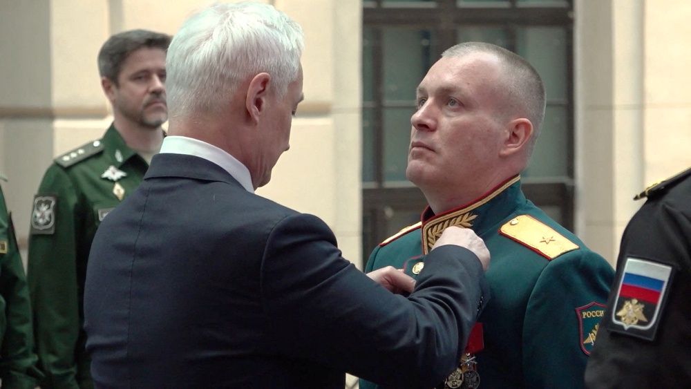 Russian Defence Minister Andrei Belousov awards General Anton Grunis the Gold Star medal and the title of Hero of Russia for courage displayed in carrying out tasks during Russia's military campaign against Ukraine, at a ceremony in Moscow, Russia, in this still image from video released August 28, 2026. (Reuters)
