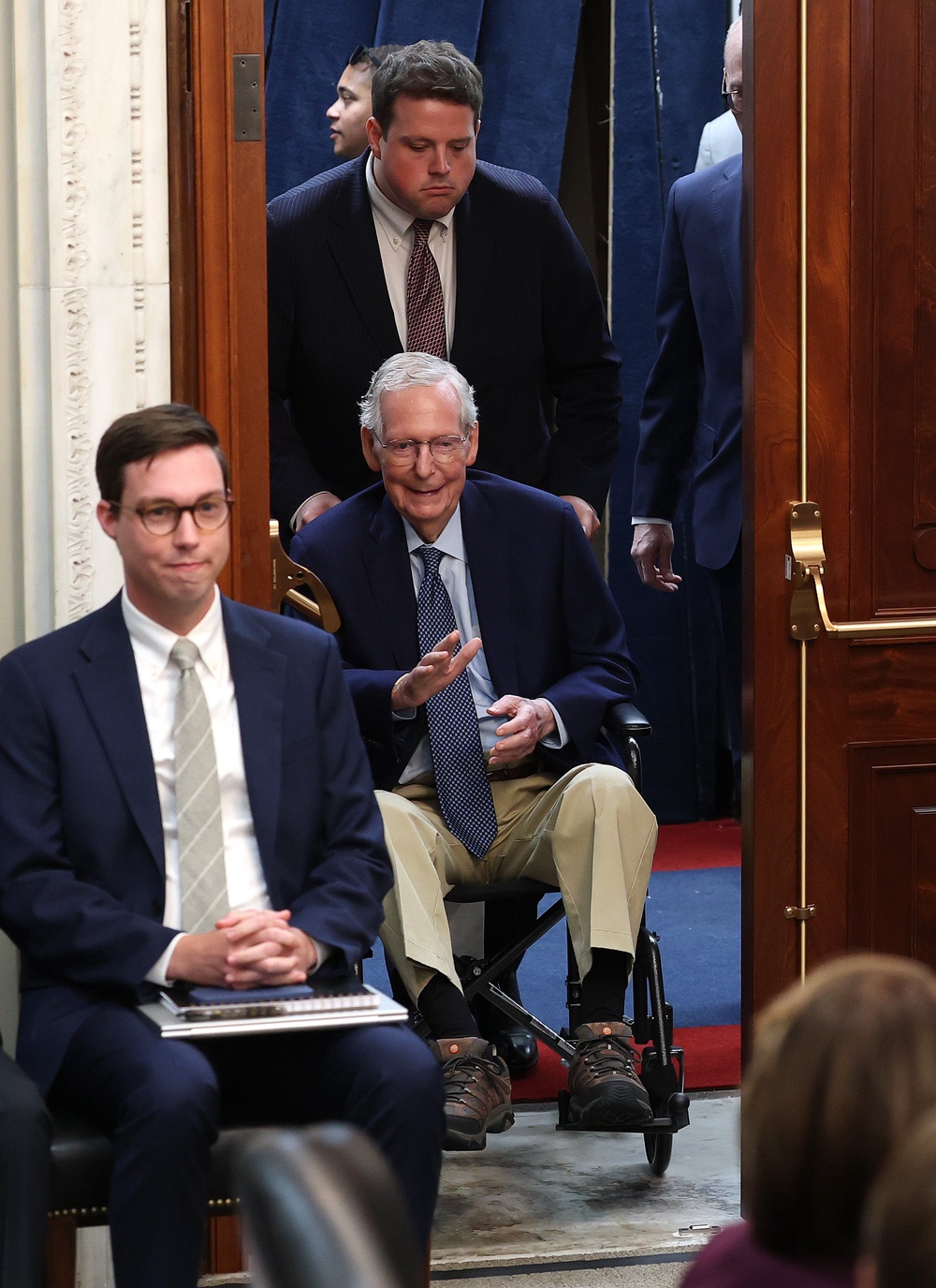 McConnell arrives Wednesday at the Agriculture committee meeting, assisted by an aide (Getty)