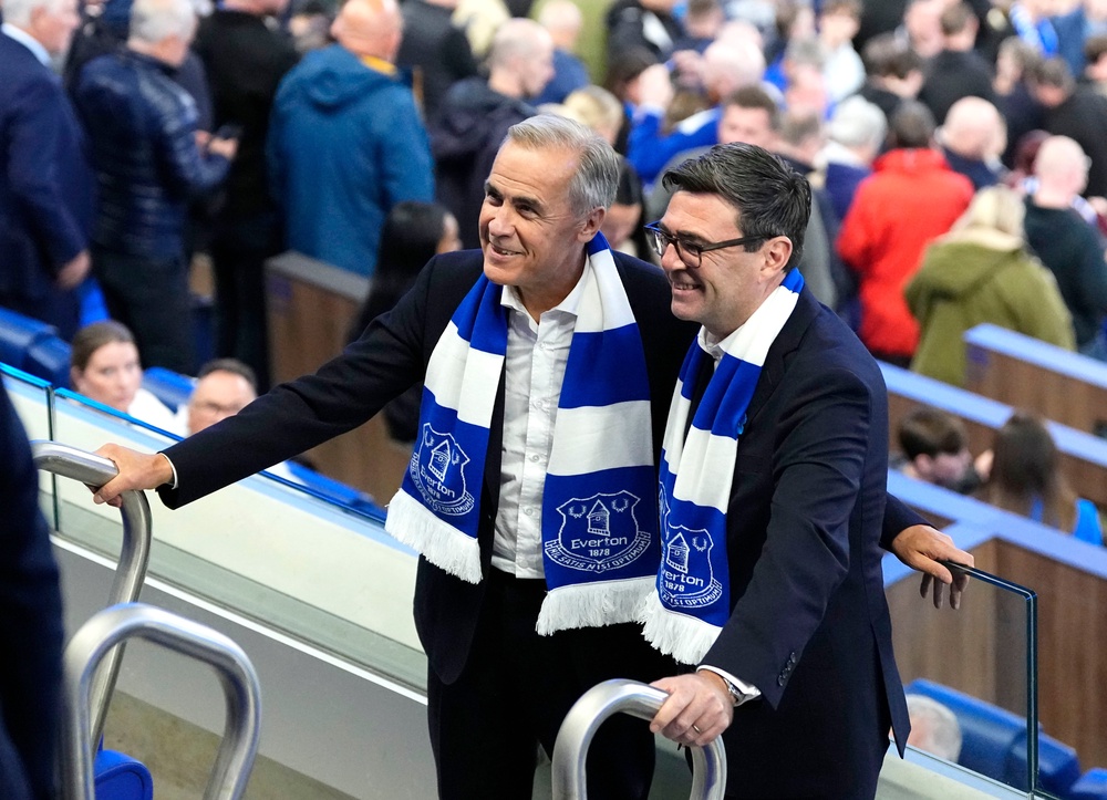 Andy Burnham and Mark Carney watched Everton beat Wolves 1-0 (AP)