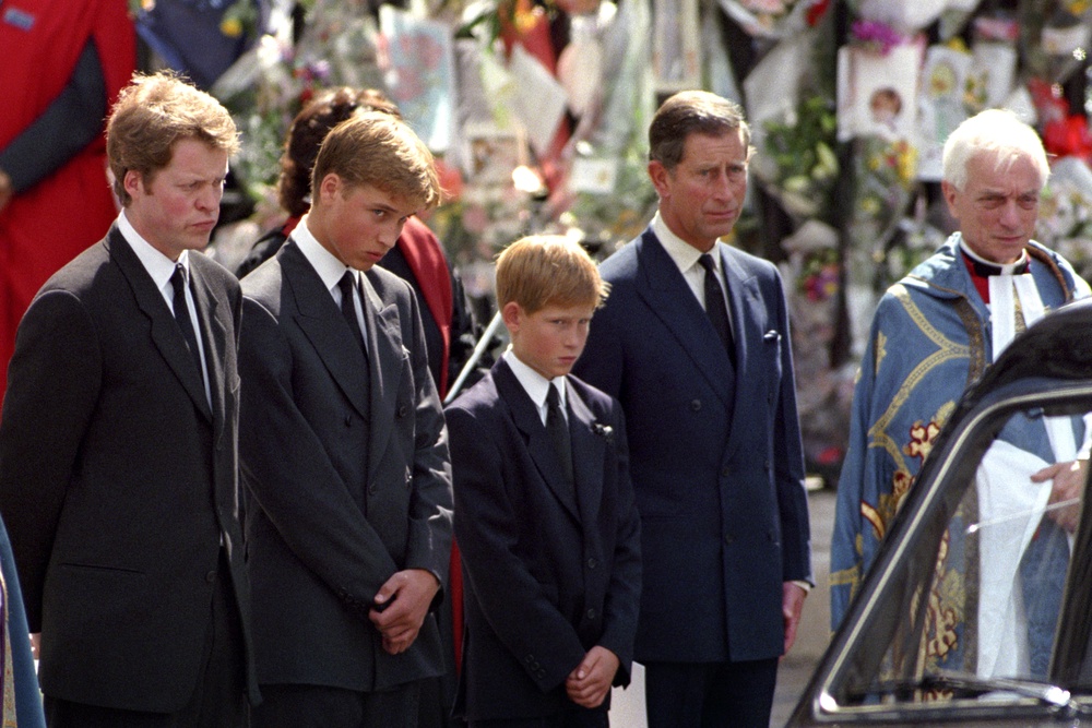 Earl Spencer, William, Harry and Charles waiting as the hearse carrying the coffin of Diana, Princess of Wales prepared to leave Westminster Abbey following her funeral (PA Archive)