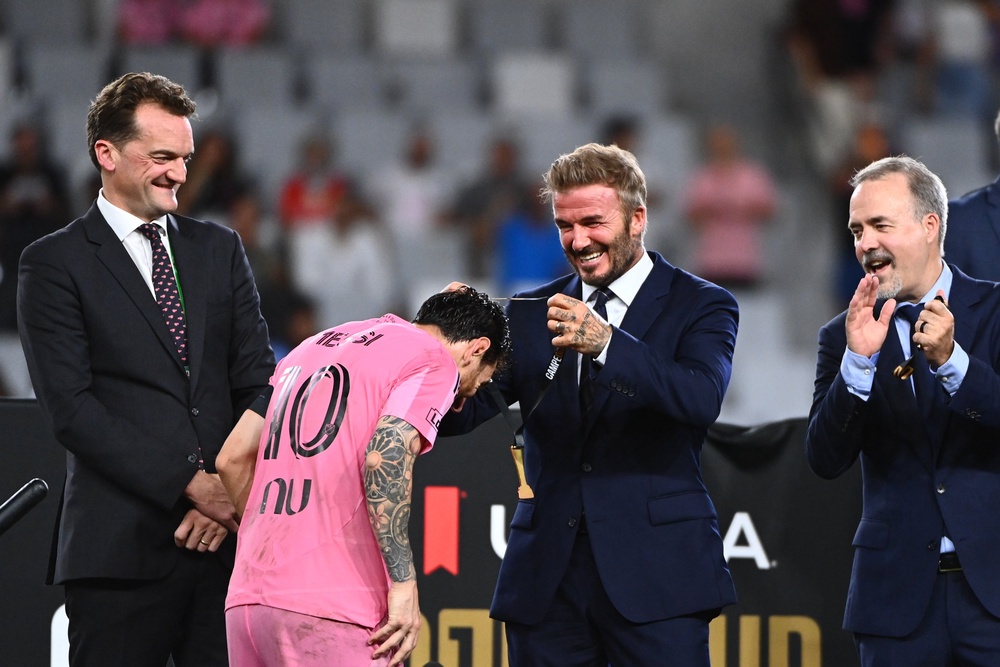Sir David Beckham, Co-owner of Inter Miami CF, gives the winner's medal to Lionel Messi (Getty)