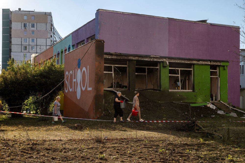 Employees carry debris from a school that was damaged by a nearby impact after Russian missile and drone strikes on Kyiv, amid Russia’s attack on Ukraine, in Kyiv, Ukraine, September 17, 2026. (Reuters)