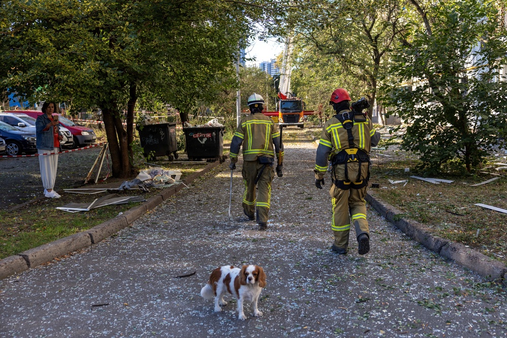 Emergency workers carry equipment to an apartment building that was damaged by a nearby impact during Russian missile and drone strikes on Kyiv, amid Russia’s attack on Ukraine, in Kyiv, Ukraine, September 17, 2026. (Reuters)