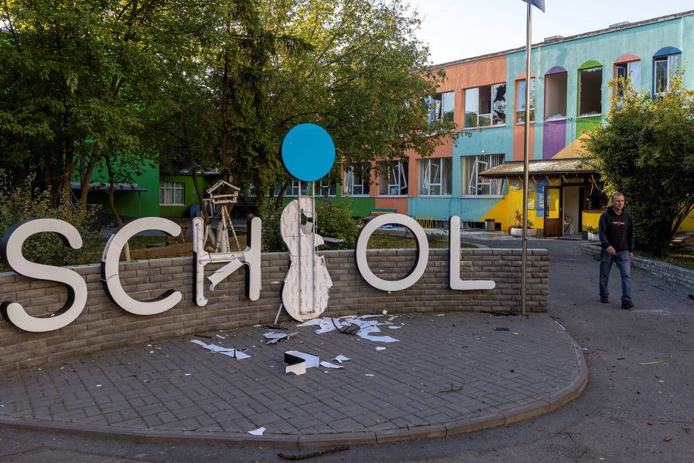 A man walks outside a school that was damaged by a nearby impact after Russian missile and drone strikes on Kyiv, amid Russia’s attack on Ukraine, in Kyiv, Ukraine, September 17, 2026. (Reuters)